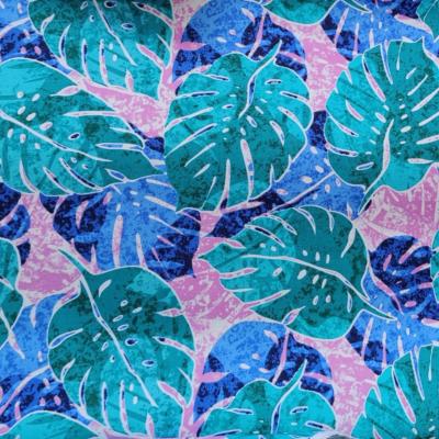 Tissu bleu turquoise et rose, grandes feuilles de monsteras