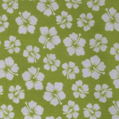 Tissu tahitien vert et petits hibiscus blancs 50 X 110 cm