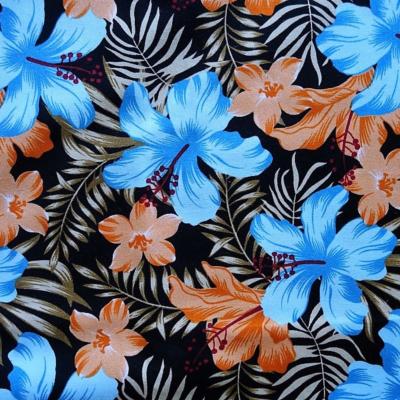 Tissu noir hibiscus orange et bleu 50 X 110 cm